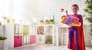 Superhero child white room with plants and boxes