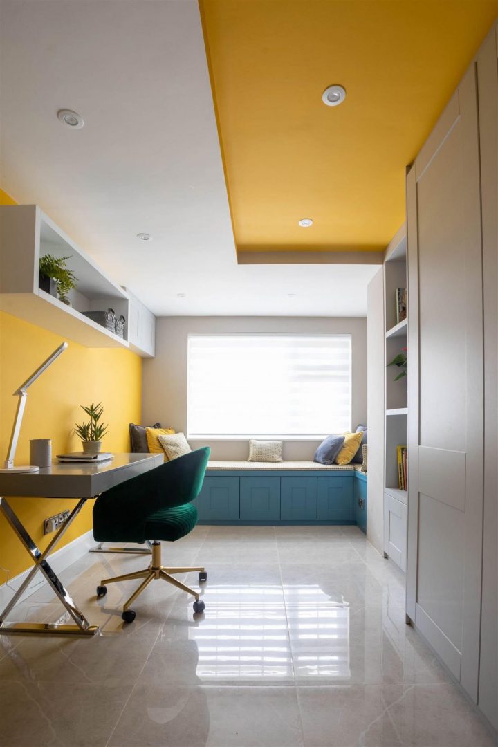 Home office design with painted yellow ceiling detail