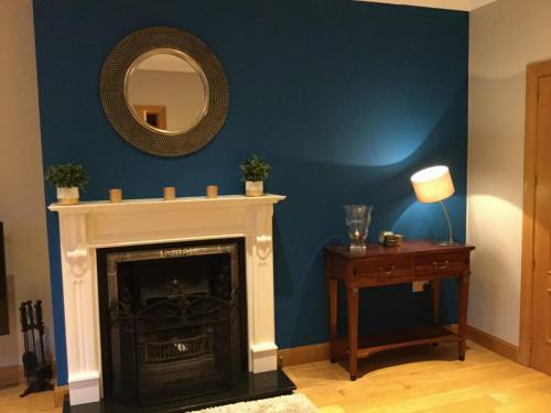 Fireplace makeover, blue littlegreene wall colour, gallery mirror