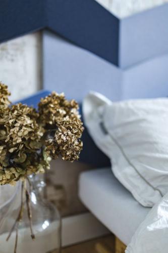 Dried hydrangea, blue geometric headboard