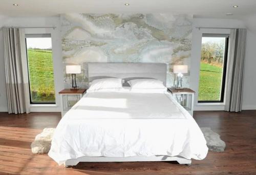 Bedroom design using wall mural, casamance fabrics, bespoke lockers