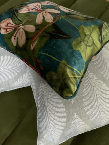 Botanical-floral-scatter-cushions-with-light-grey-palm-leave-cushions-scaled