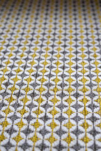 Close up of geometric gold and grey fabric