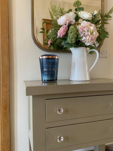 Farrow  Ball Painted unit with brass framed mirror