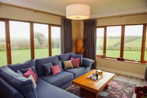 Finline corner chaise sofa with bespoke cushions and bluebell rug