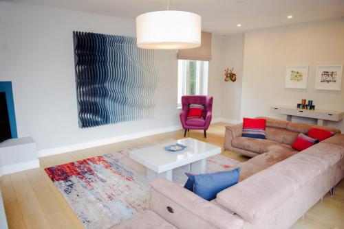 Home of the Year collaboration - sitting room with handknotted abstract wool/silk rug from @rugs.ie