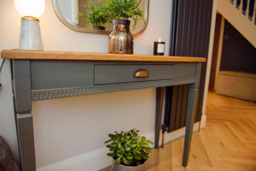 Indigo blue console hall table with gold frame mirror