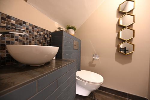 Guest bathroom under a stairs design