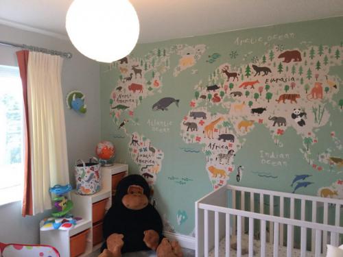 Childs bedroom design with world map mural