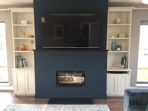 TV/fireplace wall design with bespoke wall units