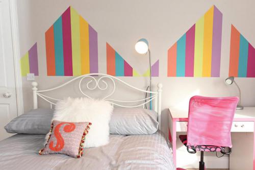 Childs bedroom design with rainbow wall colour pattern