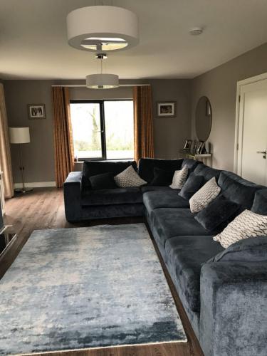 Midnight blue corner sofa in living room design